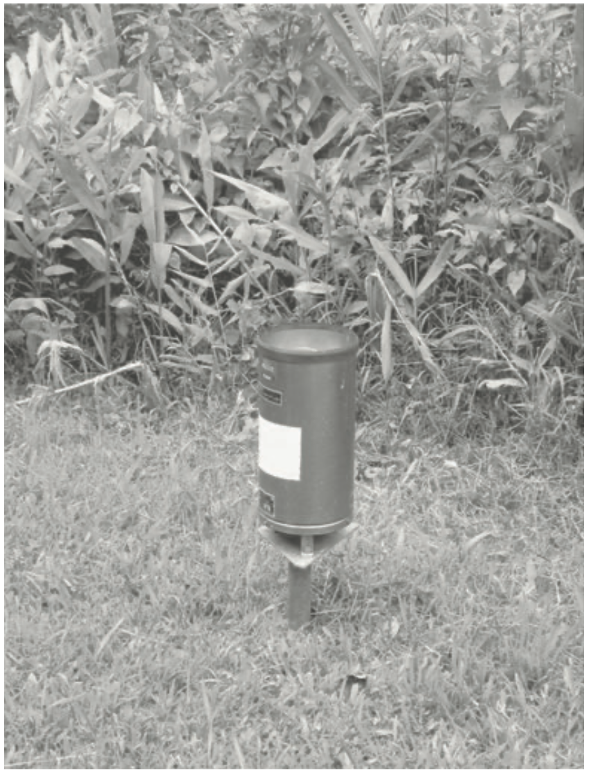Rain gauge sitting above the surface to avoid splash. Text
